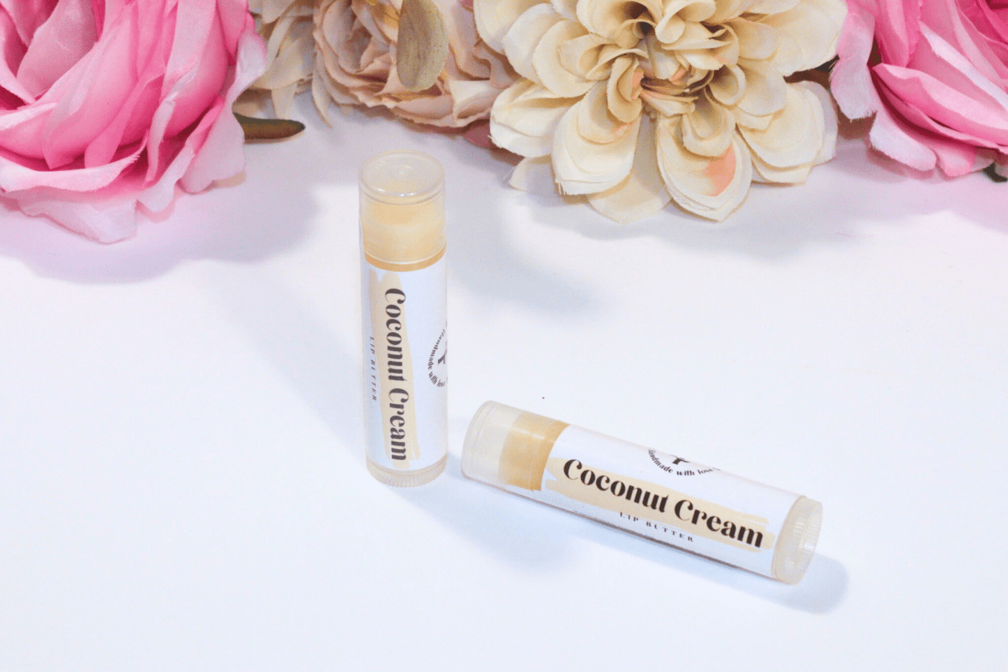 Hydrating Lip Butter in a sleek container, providing intense hydration and protection with a refreshing coconut cream flavor