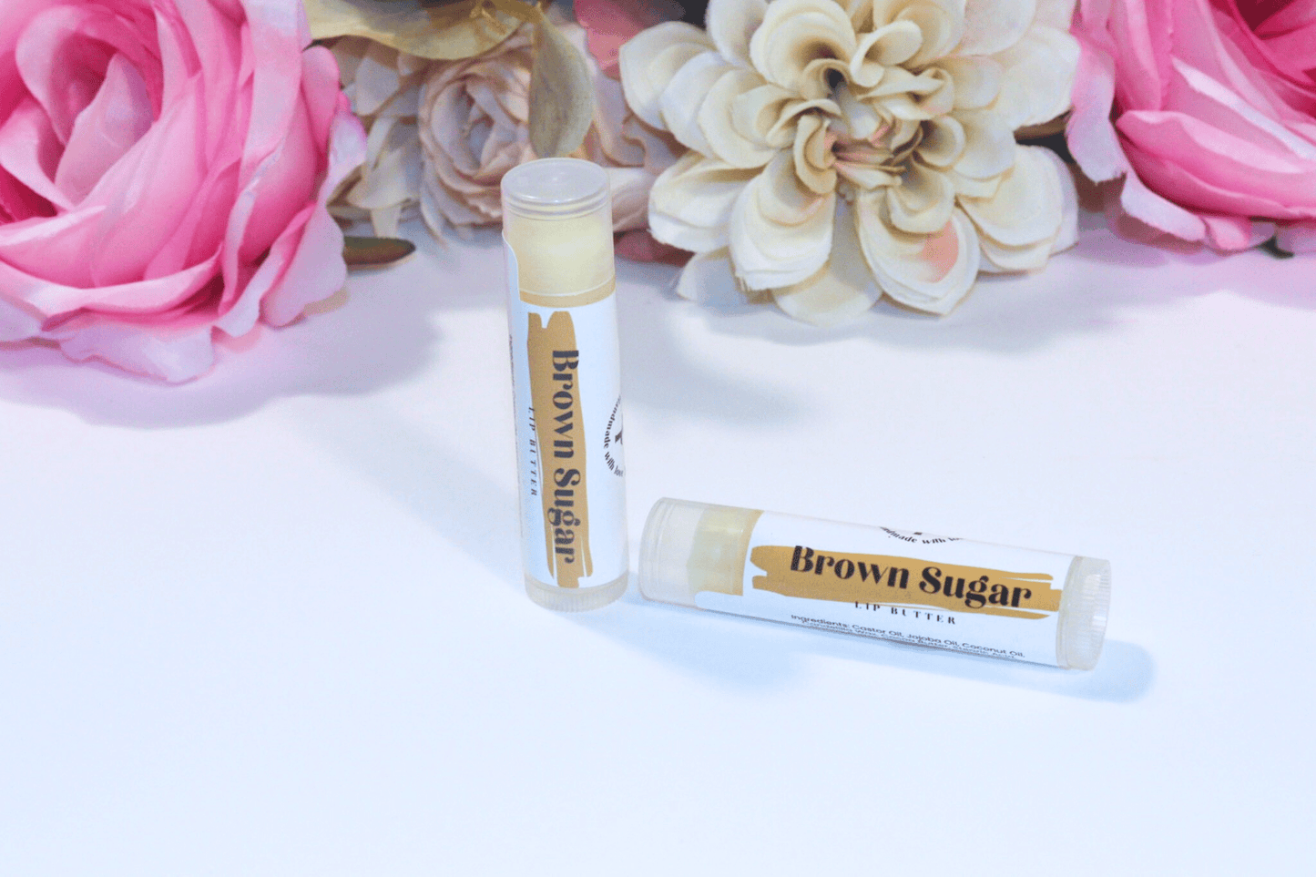 Hydrating Lip Butter in a sleek container, providing intense hydration and protection with a refreshing brown sugar flavor