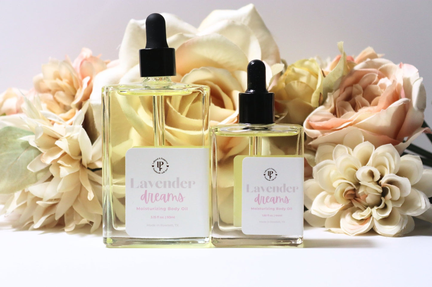 Clear bottle of Lavender Dreams body oil with scent notes of lavender, coconut water and eucalyptus